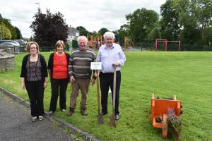 People with Traditional Tools for digging out Turf