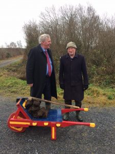 Two People with Turf Cutting Barrow